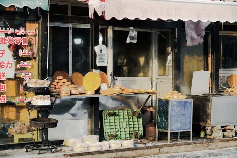 A colorful assortment of sandwiches from different countries arranged on a wooden table.